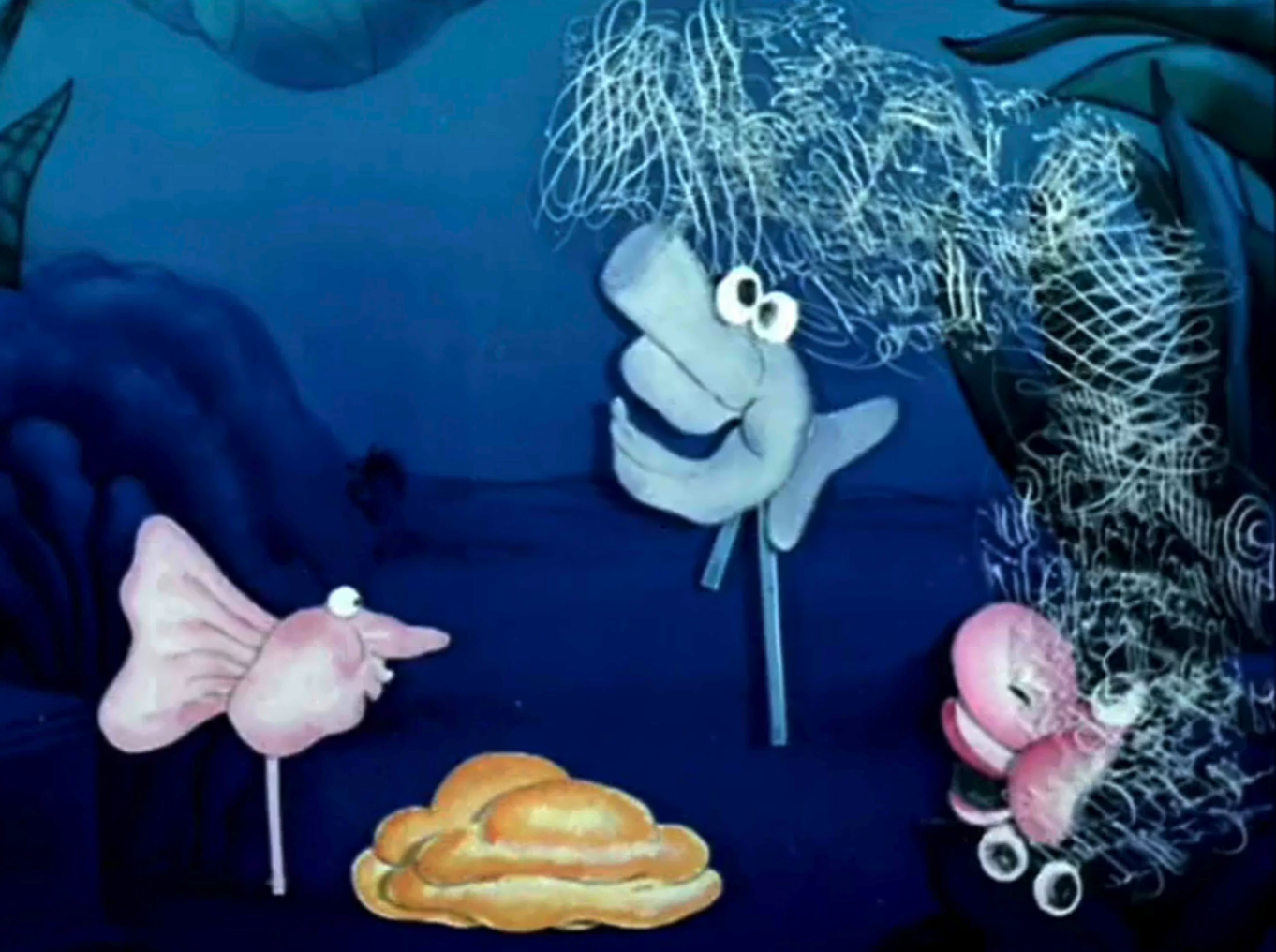 still from animation depicting hand drawn cartoonish creatures dance in a circle in a blue-toned environment. 