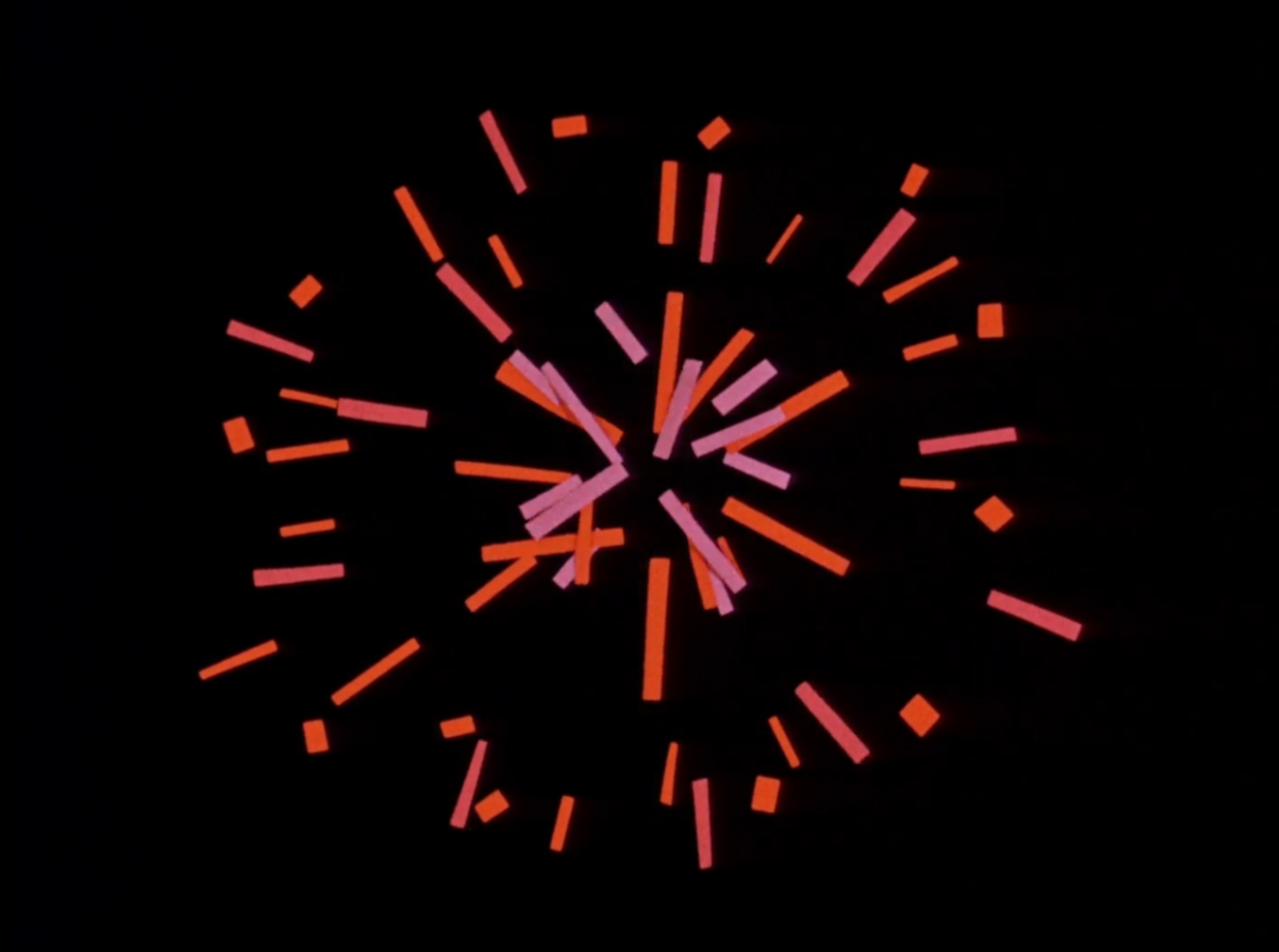 still from paper cut animation depicting red and pink scraps of paper on a black background bursting apart like a firework