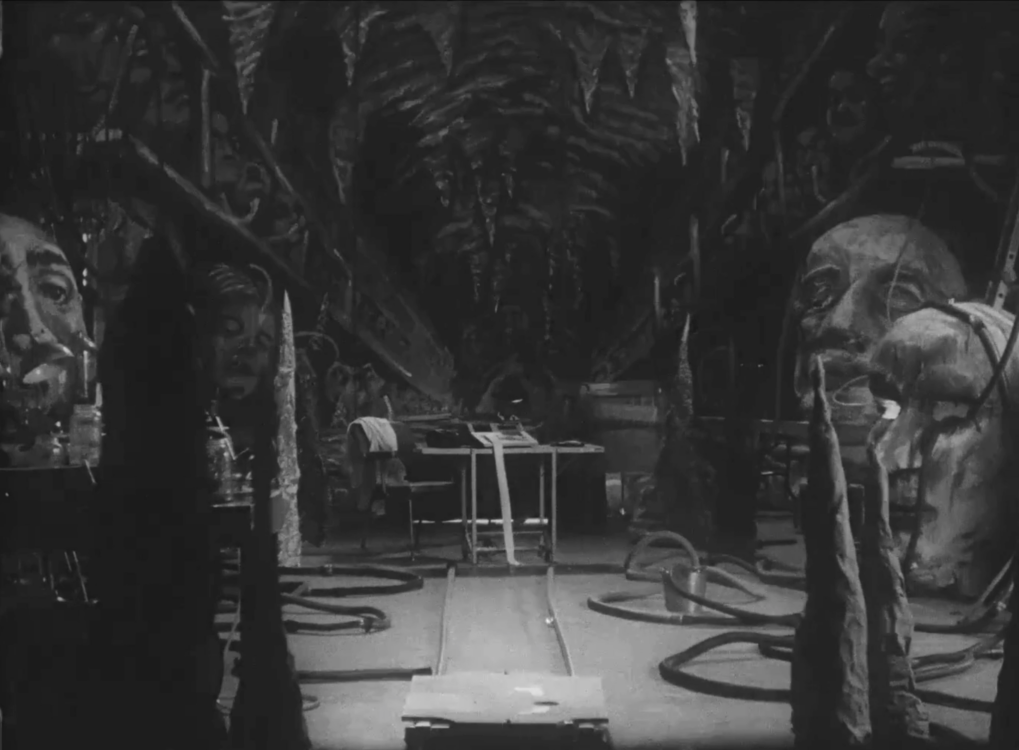 black and white film still depicting painted set in the style of Méliès