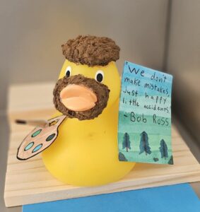 Rubber duck decorated as Bob Ross