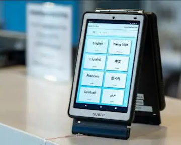 Dual-sided tablet showing multiple language options for live translation